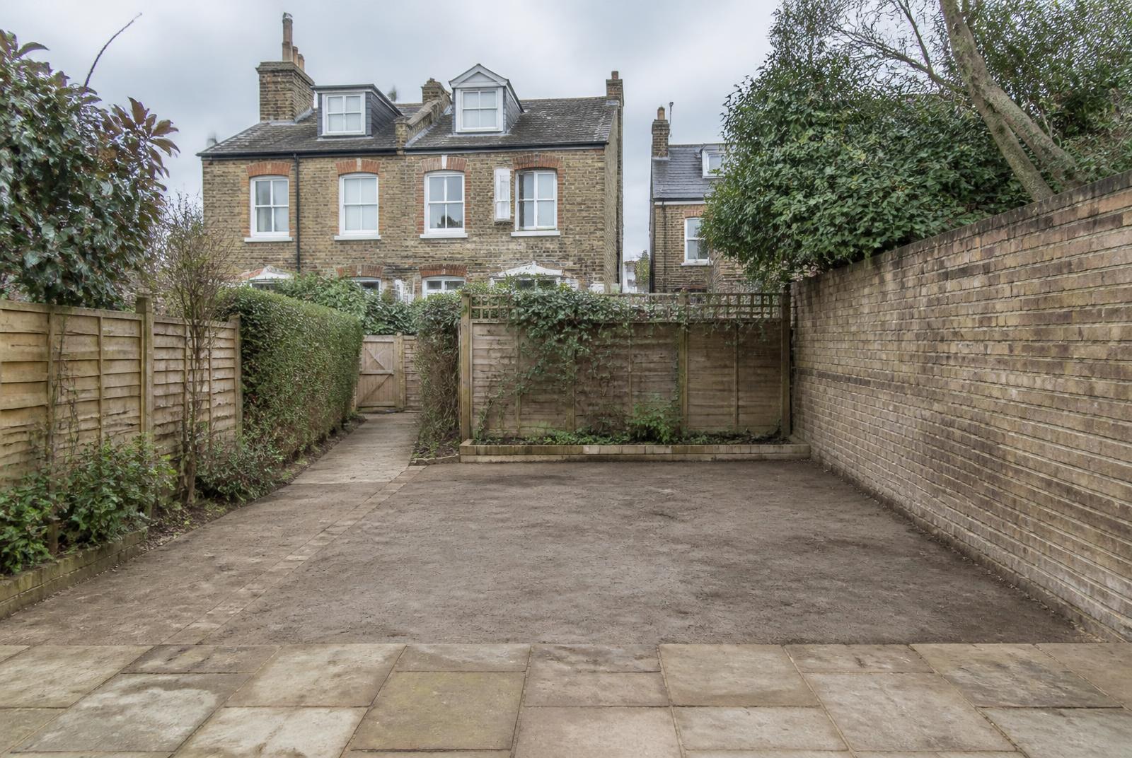 Illustrative cleared London garden site after a structure has been removed
