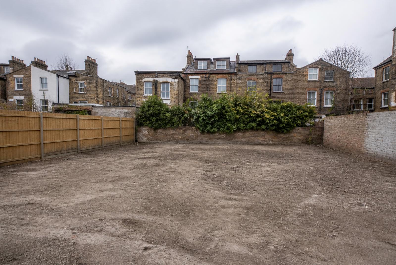 Illustrative cleared London project site ready for builders